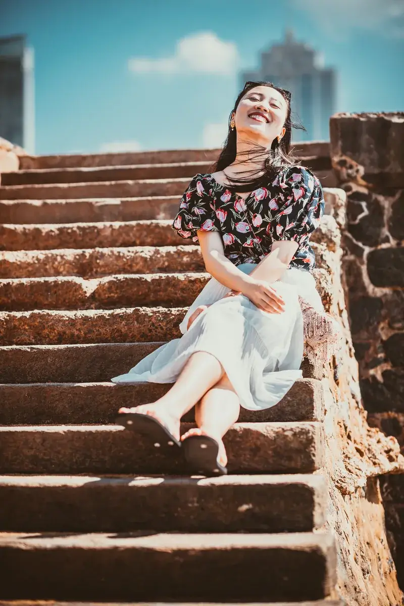Editorial fashion portrait photographed on outdoor steps