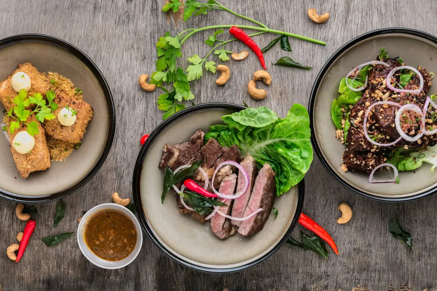 Styled dishes photographed from above on a wooden table