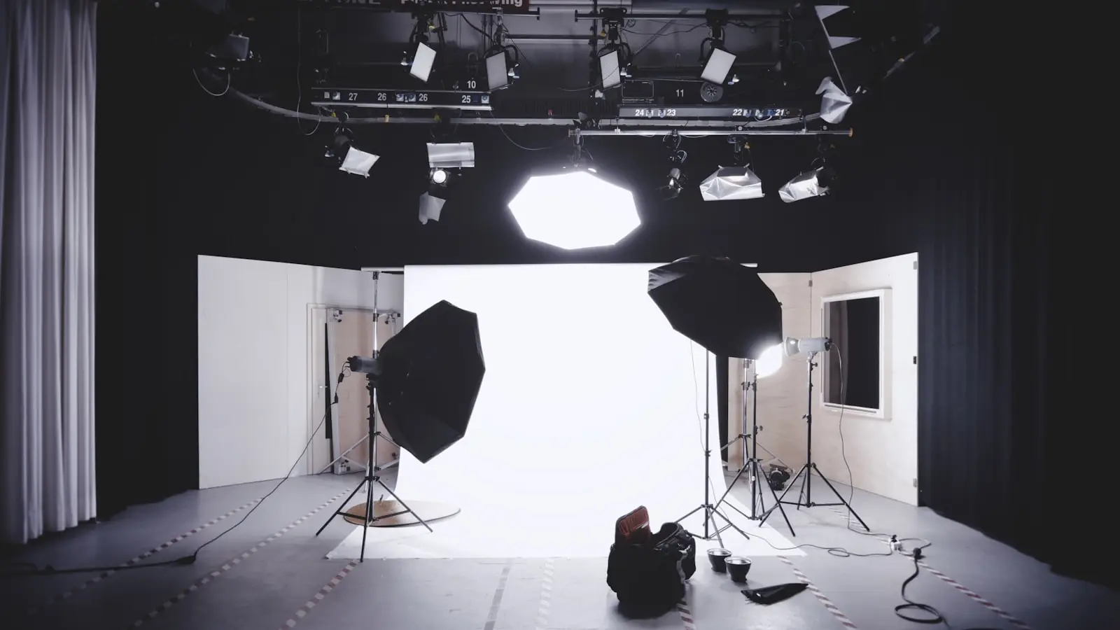 Professional photography studio with backdrop and lighting equipment